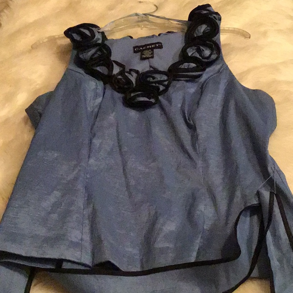 Blue blouse trimmed in black